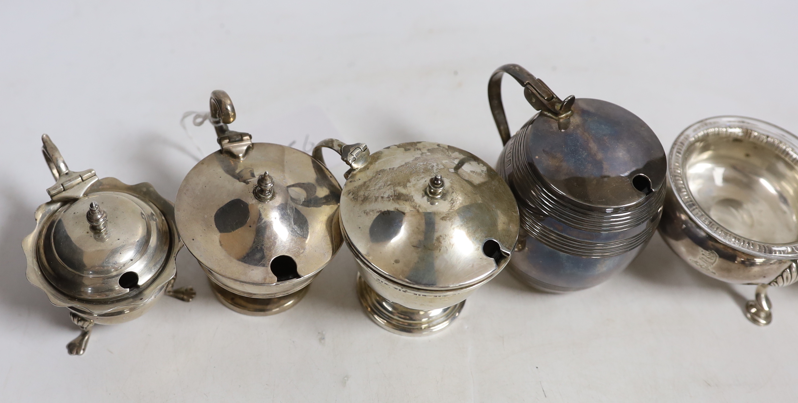A pair of George III silver bun salts, London, 1767, together with four assorted George V silver mustard pots.